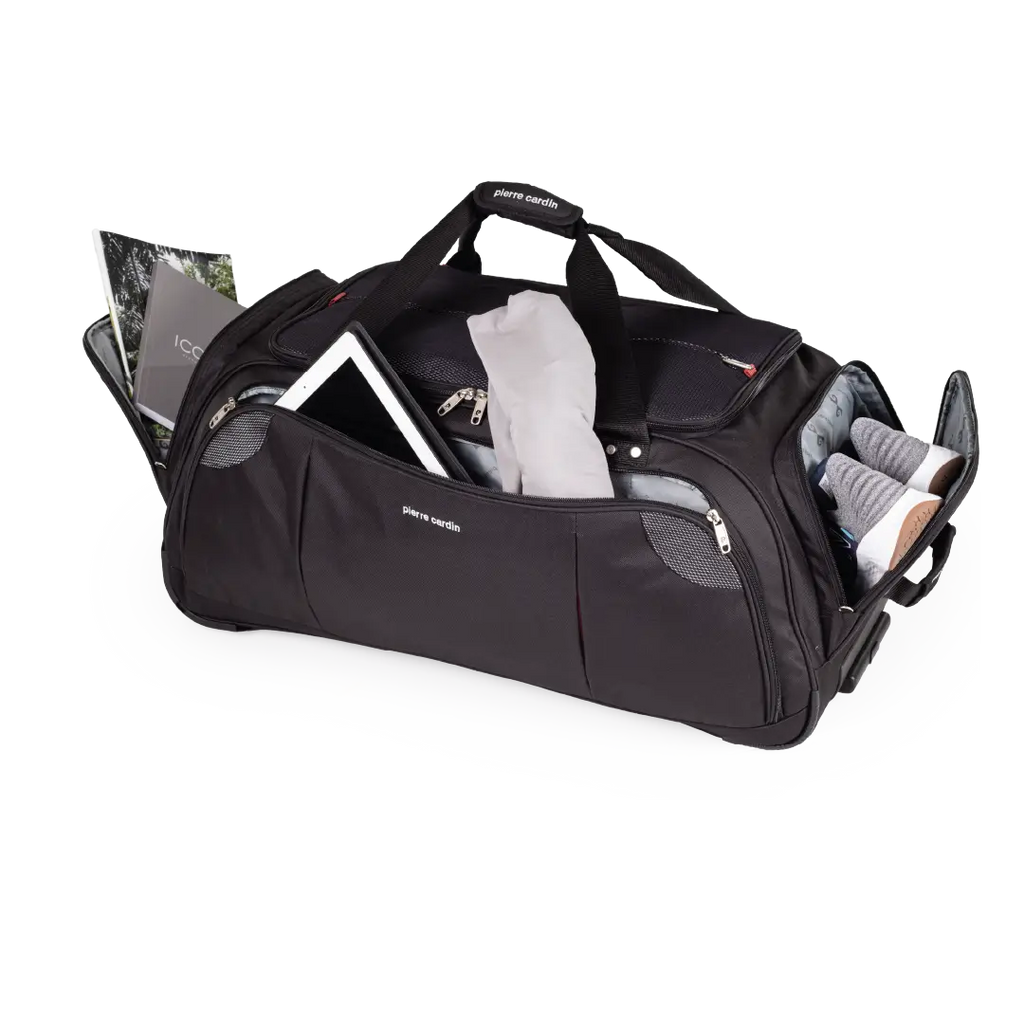 Black duffel bag with various items on a white background