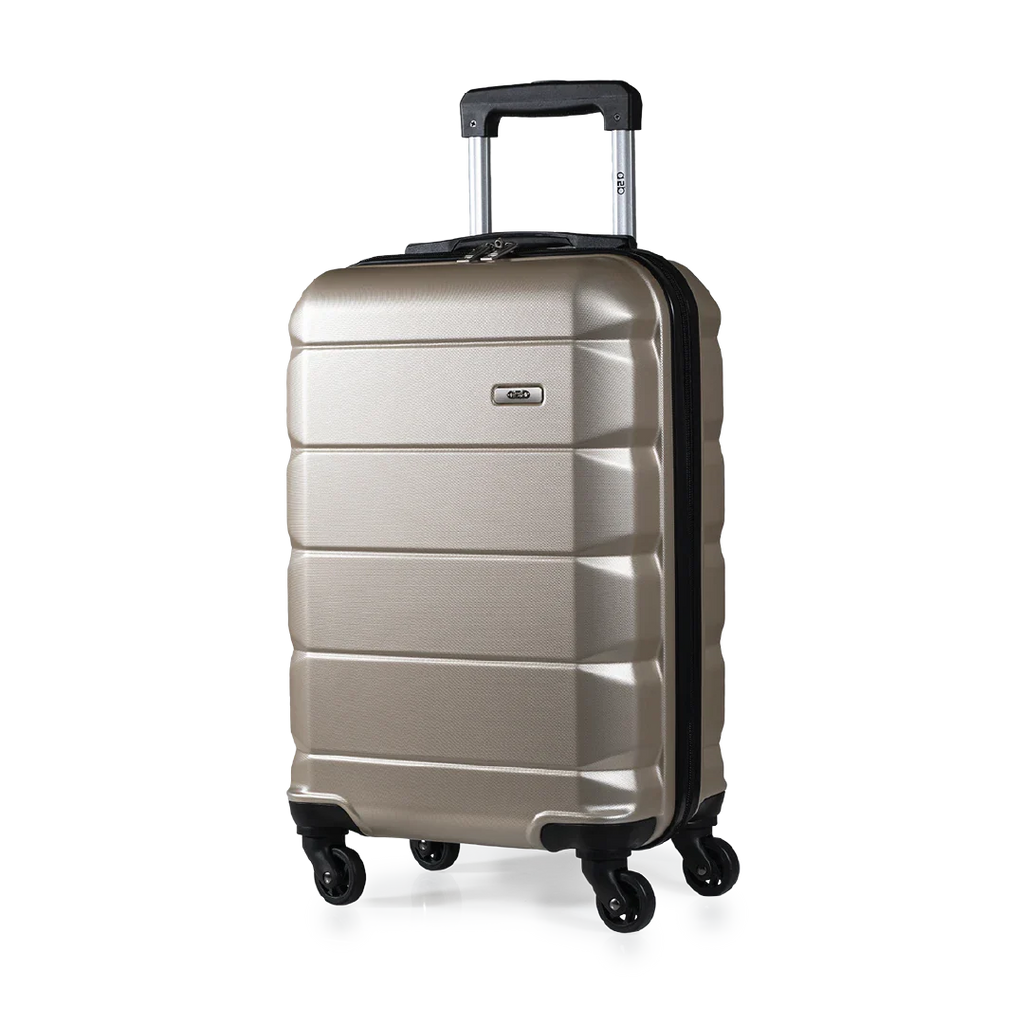 Gold suitcase with wheels on a white background