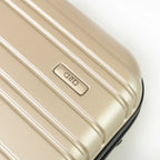 Beige suitcase with a brand logo on a white background