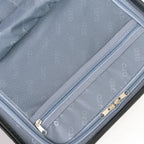 Close-up of a suitcase with zippers and mesh pocket on a white background
