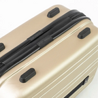 Beige suitcase with black handle and wheels on a white background