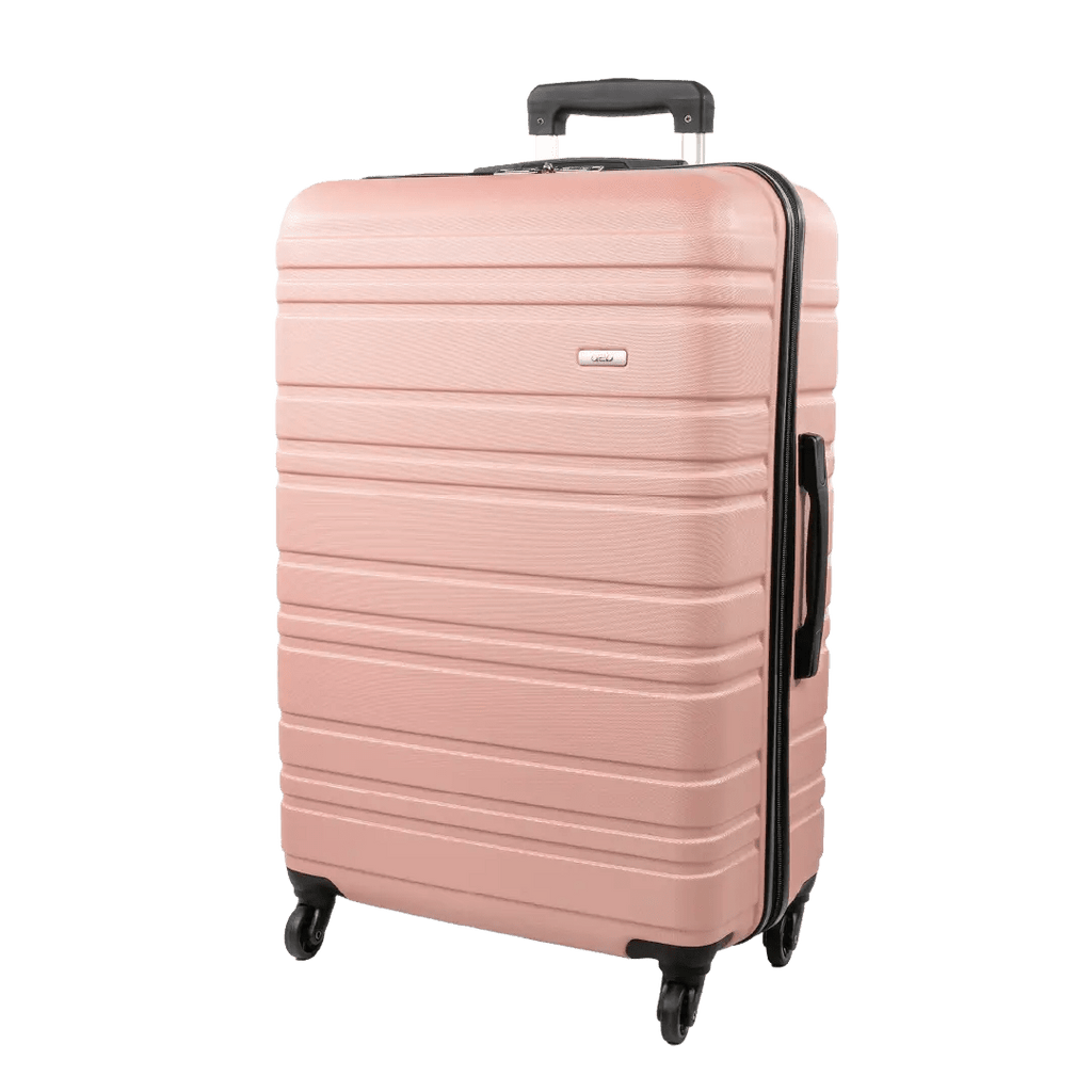 Pink suitcase with black handle and wheels on a white background