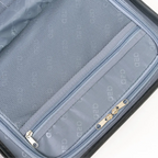 Close-up of a gray suitcase with zippers and mesh pocket