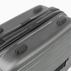 Close-up of a gray suitcase with black handles on a white background