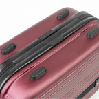 Close-up of a maroon suitcase with black handle and wheels on a white background