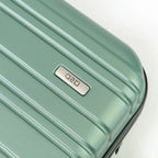 Mint green suitcase with a brand logo on a light gray background