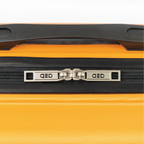Close-up of a yellow suitcase with a black handle and zipper, featuring the brand.