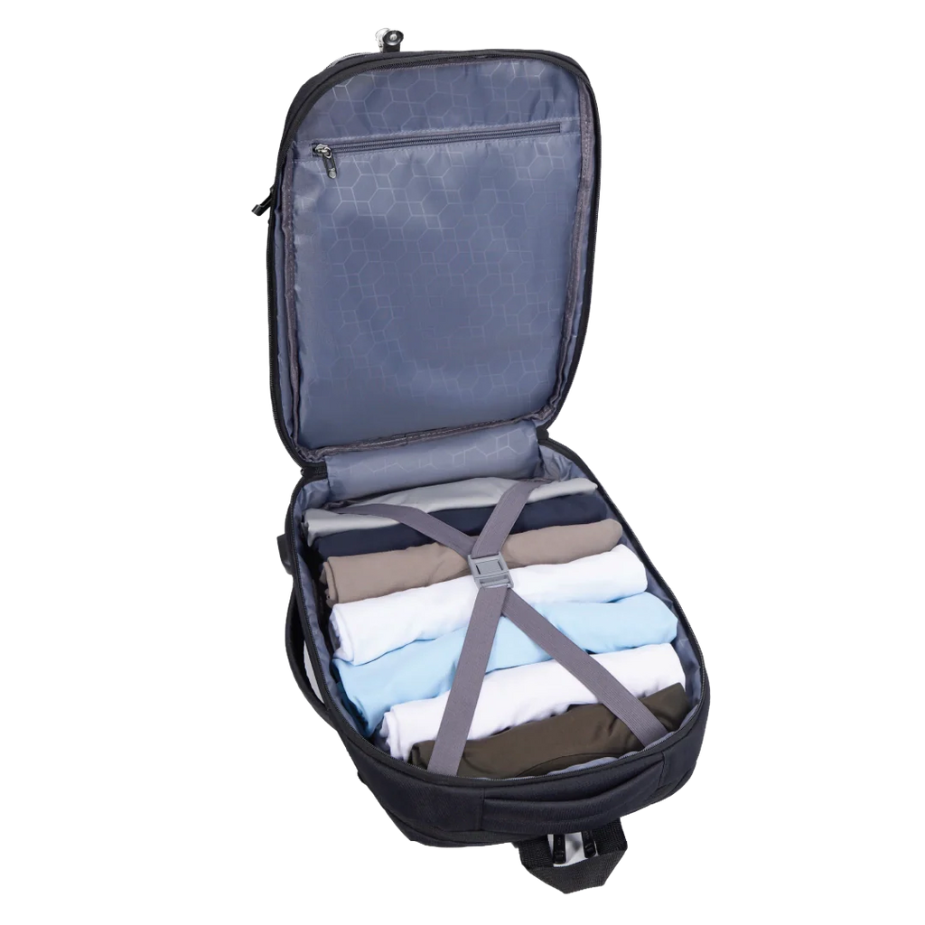 Open suitcase with folded clothes and straps on a white background