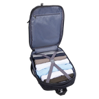 Open suitcase with folded clothes and straps on a white background