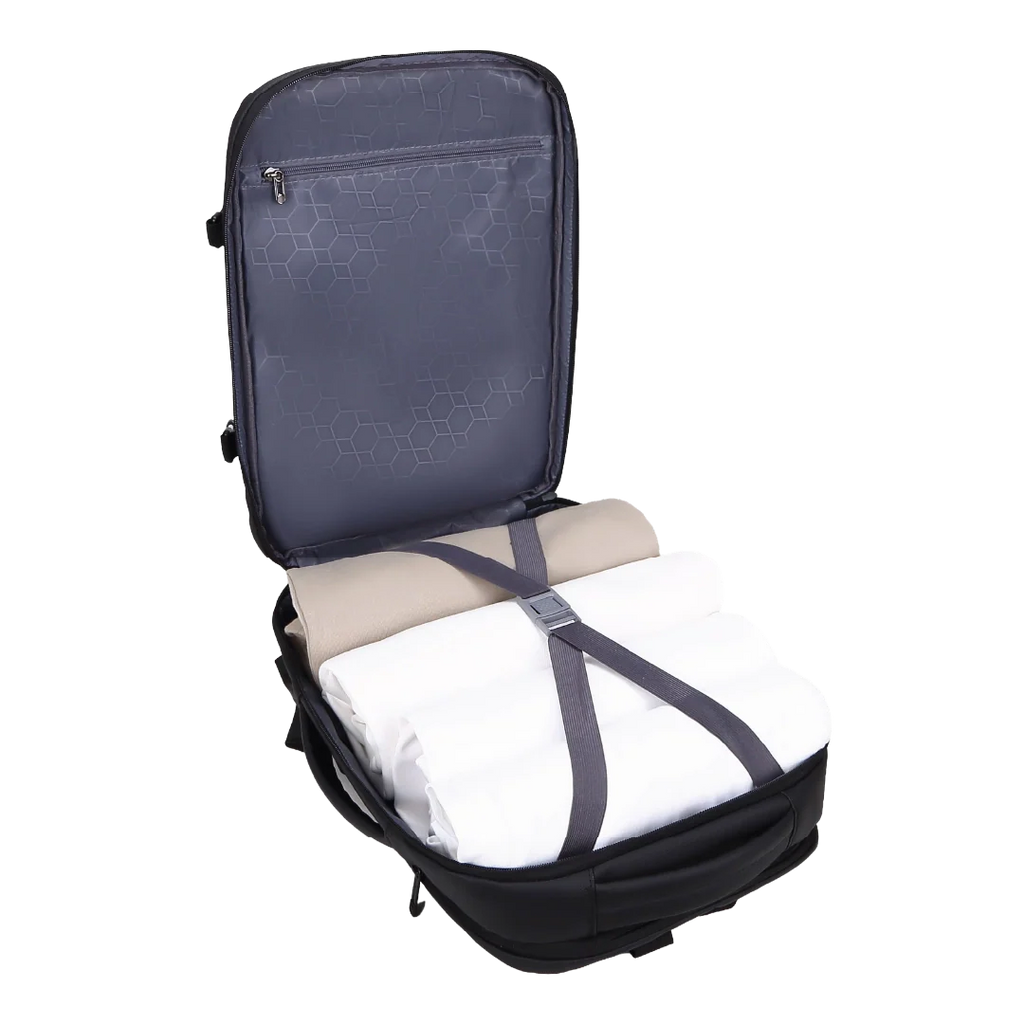 Open backpack with folded clothes inside on a white background