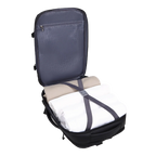 Open backpack with folded clothes inside on a white background