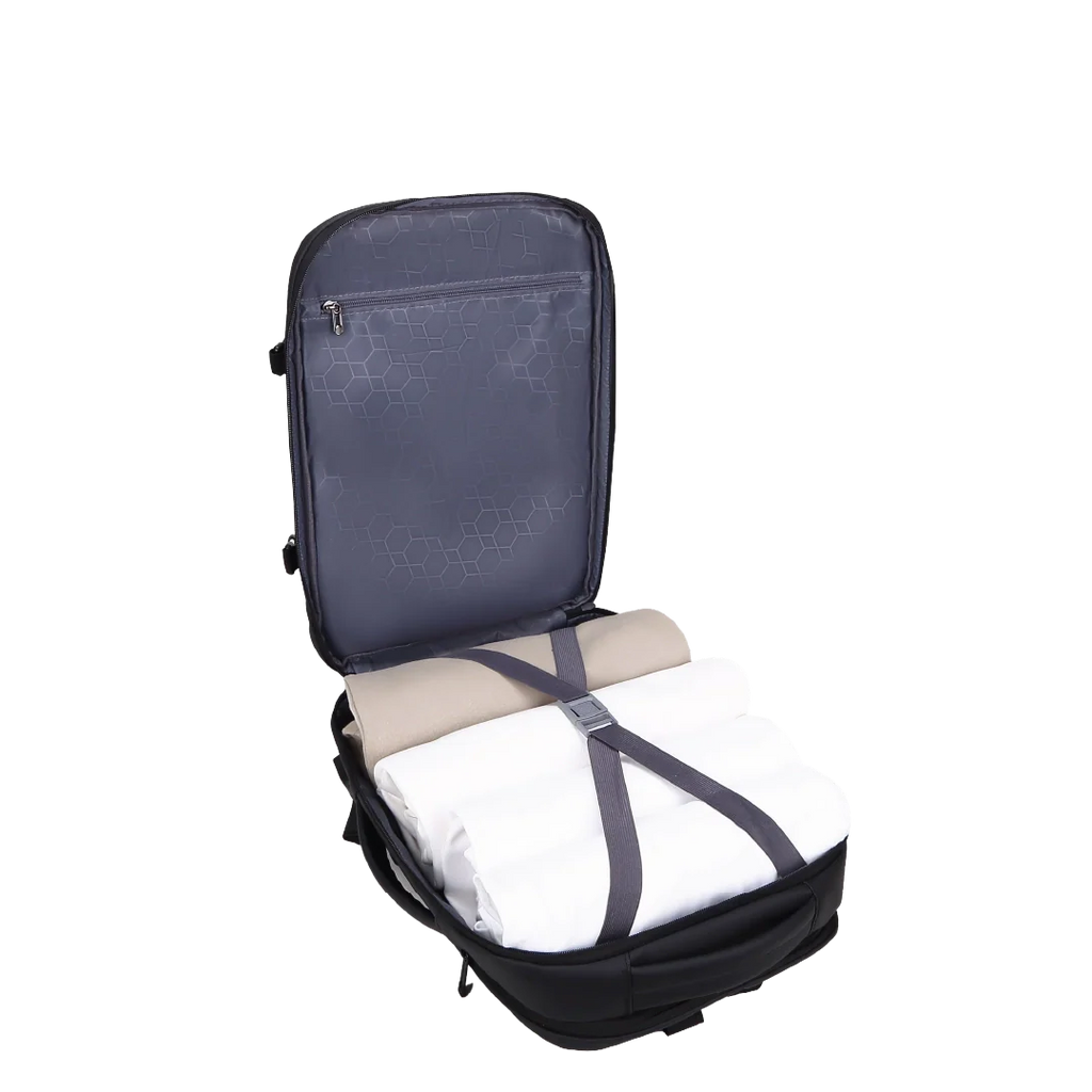 Backpack with folded clothes inside on a white background