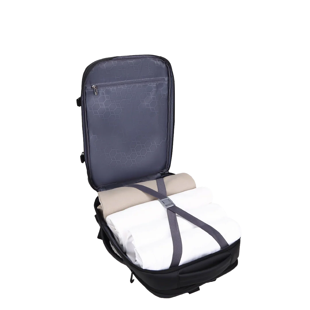 Backpack with folded clothes inside on a white background