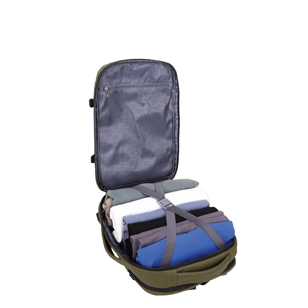 Backpack opened and filled with clothes secured by a strap.