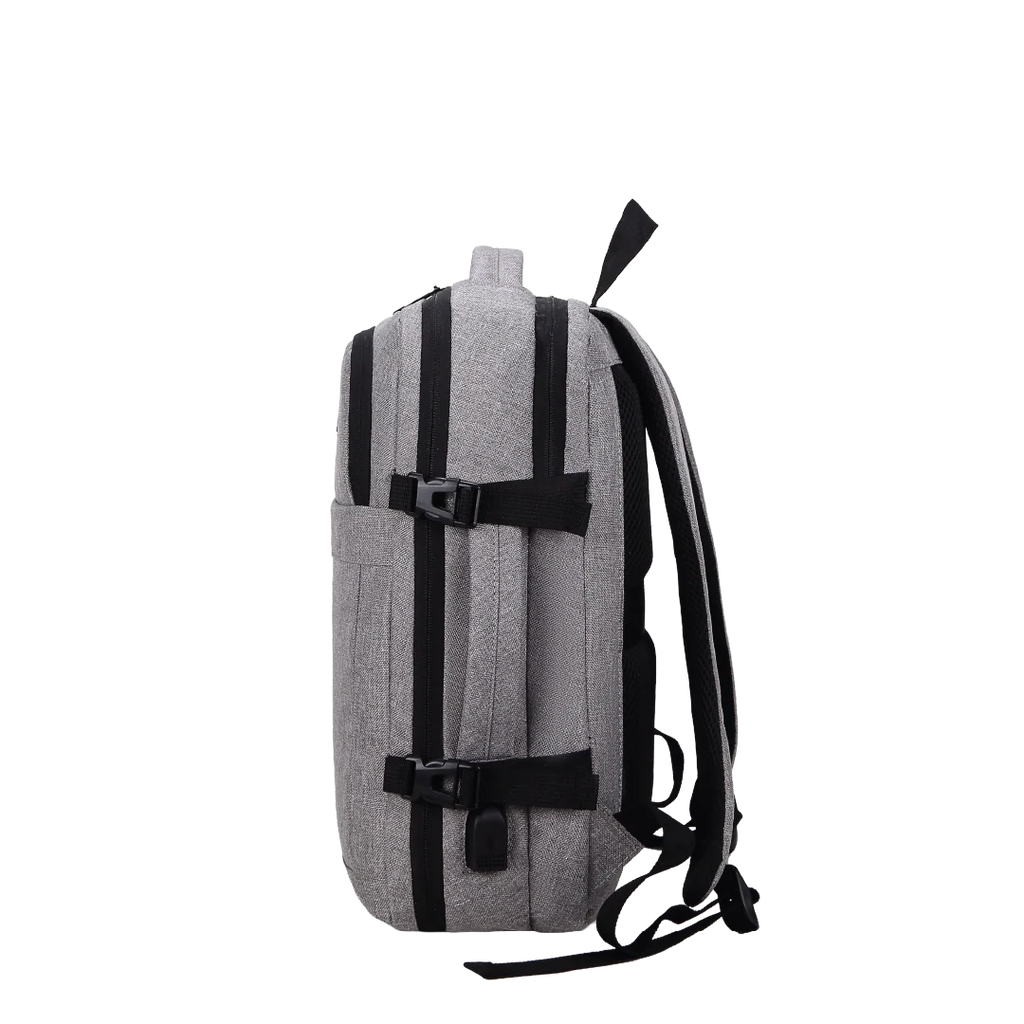 Sideview of a grey backpack with straps and a handle.