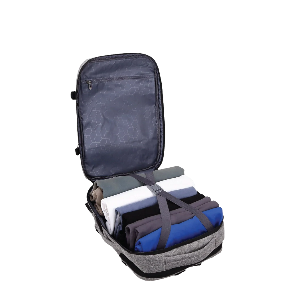 Grey backpack with clothes inside and a strap over them.