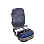 Grey backpack with clothes inside and a strap over them.