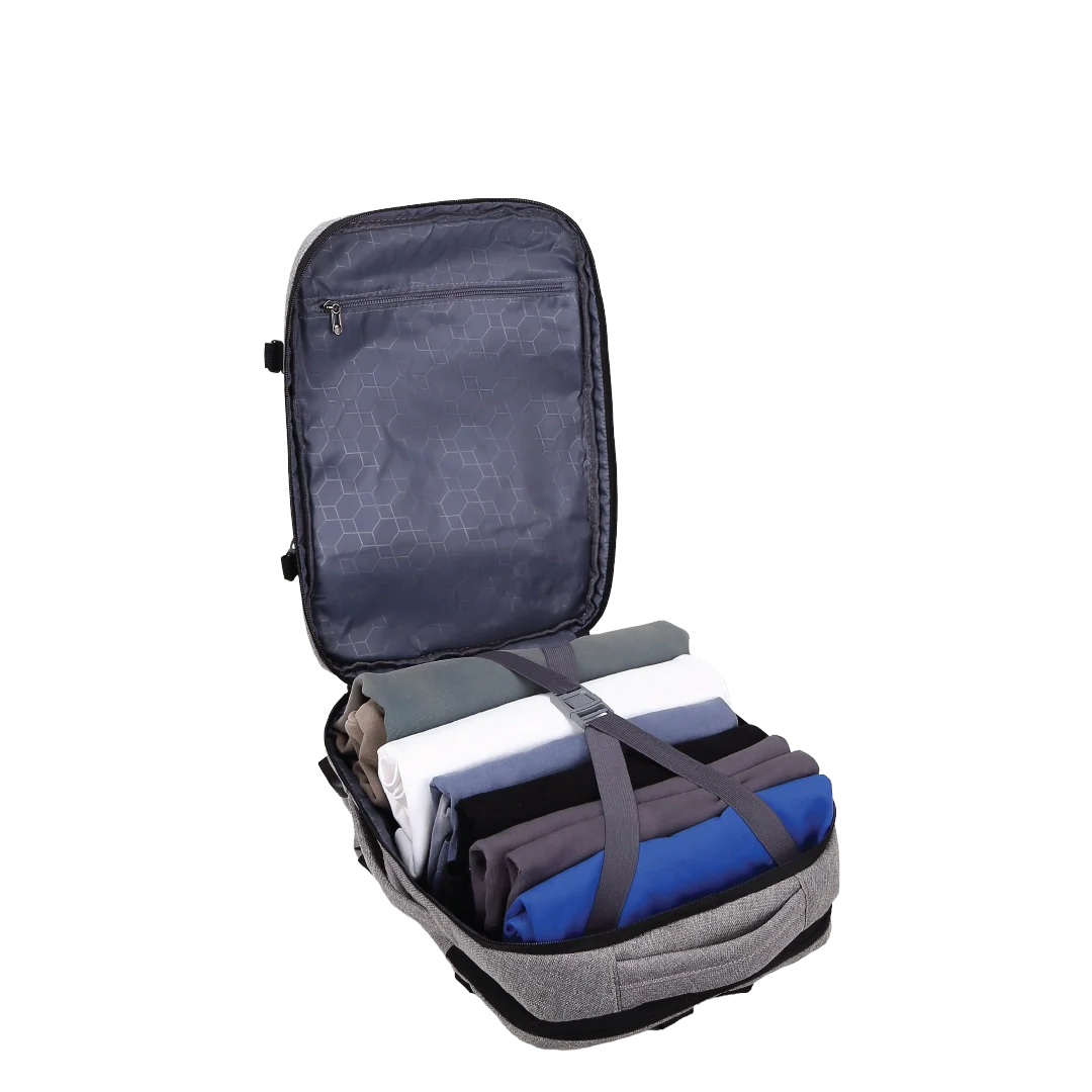 Grey backpack with clothes inside and a strap over them.