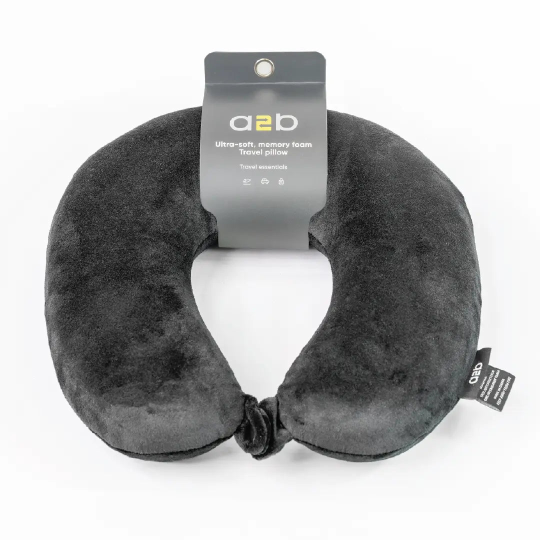 Gray travel neck pillow with a2b brand label on a white background