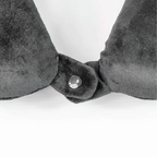 Gray velvet headband with a central button on a white background