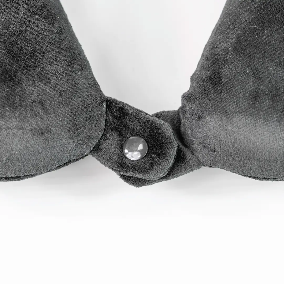 Gray velvet headband with a central button on a white background