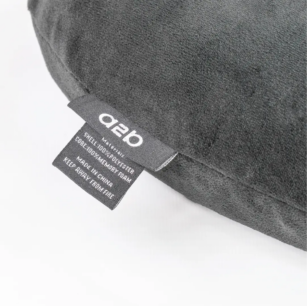 Gray pillow with a label on a white background
