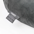 Gray pillow with a label on a white background