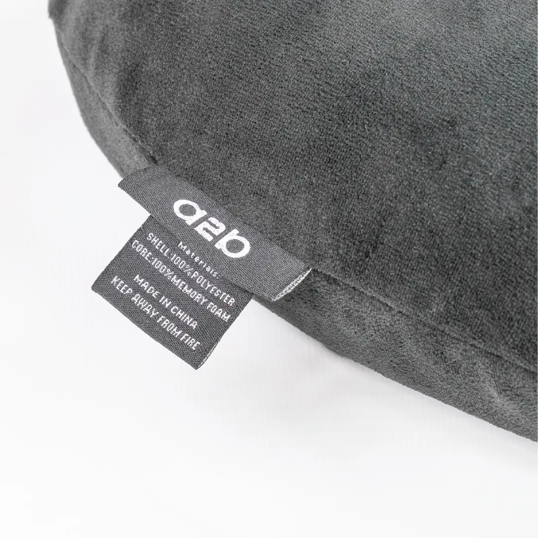Gray pillow with a label on a white background