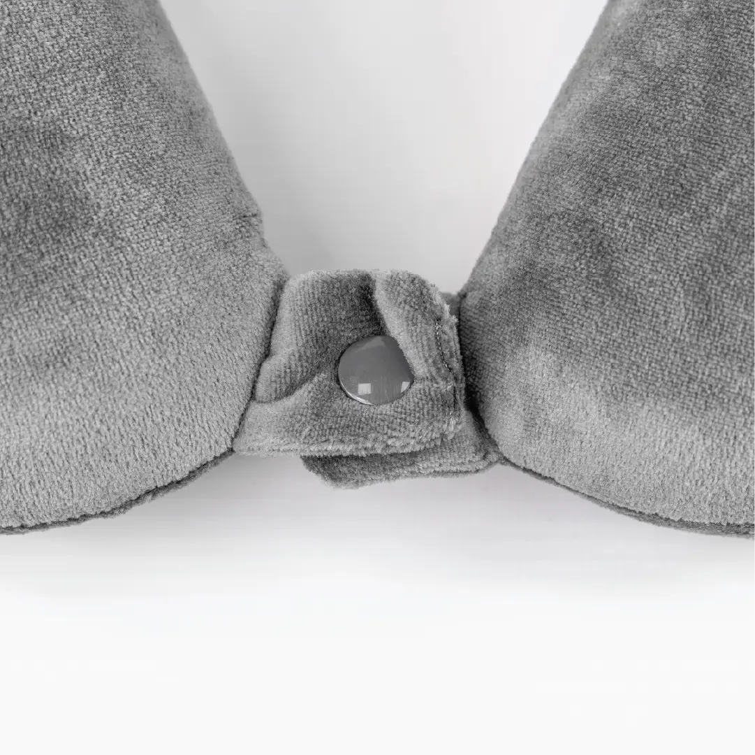 Gray towel with a button on a white background