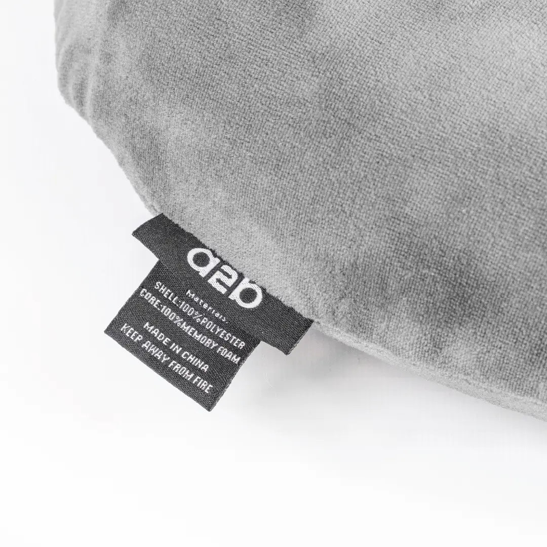 Gray pillow with a label on a white background