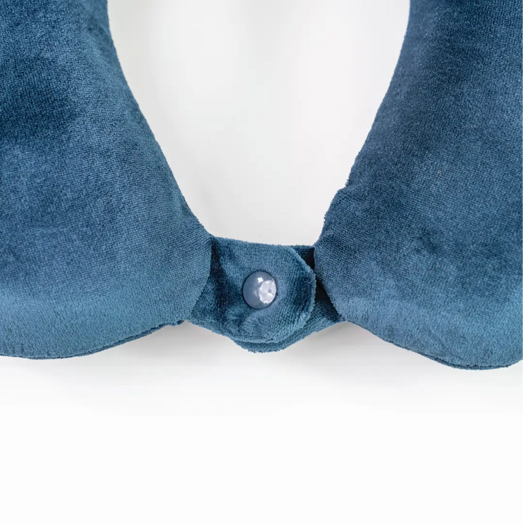 Blue velvet collar with a button on a white background
