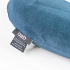 Blue pillow with a label on a white background