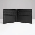 Open black wallet with multiple compartments and brand logo