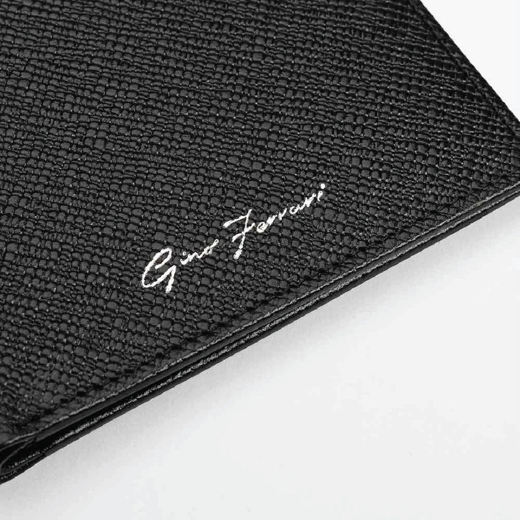 Close-up of a black leather wallet with brand logo