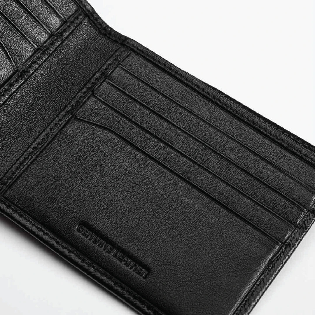 Close-up of a black leather wallet with visible stitching on a white background