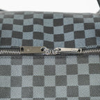 Close-up of a checkered pattern with a zipper on a gray background