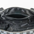 Black handbag with a visible brand logo on a white background