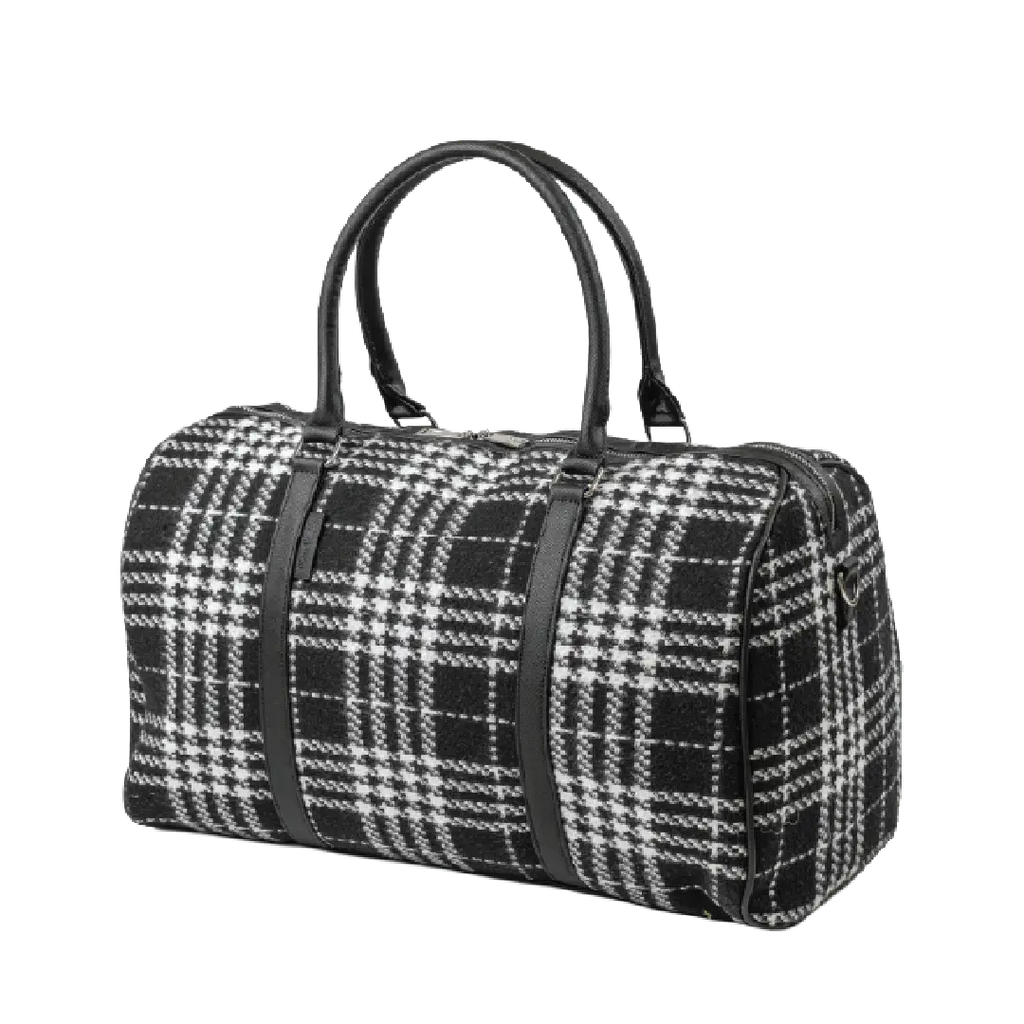 Black and white plaid duffel bag with black straps on a white background