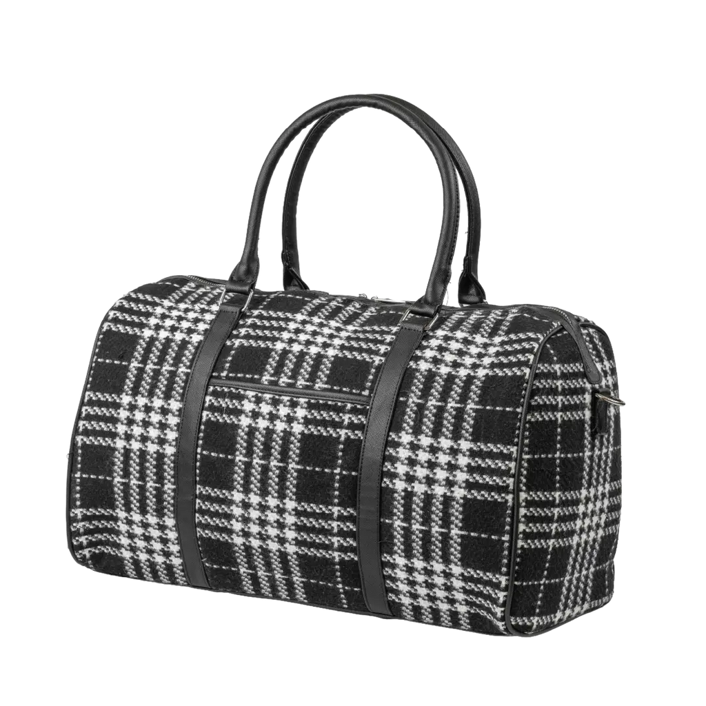 Black and white checkered duffel bag with black straps on a white background