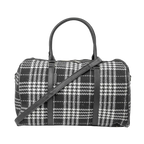 Black and white plaid handbag with a shoulder strap on a white background