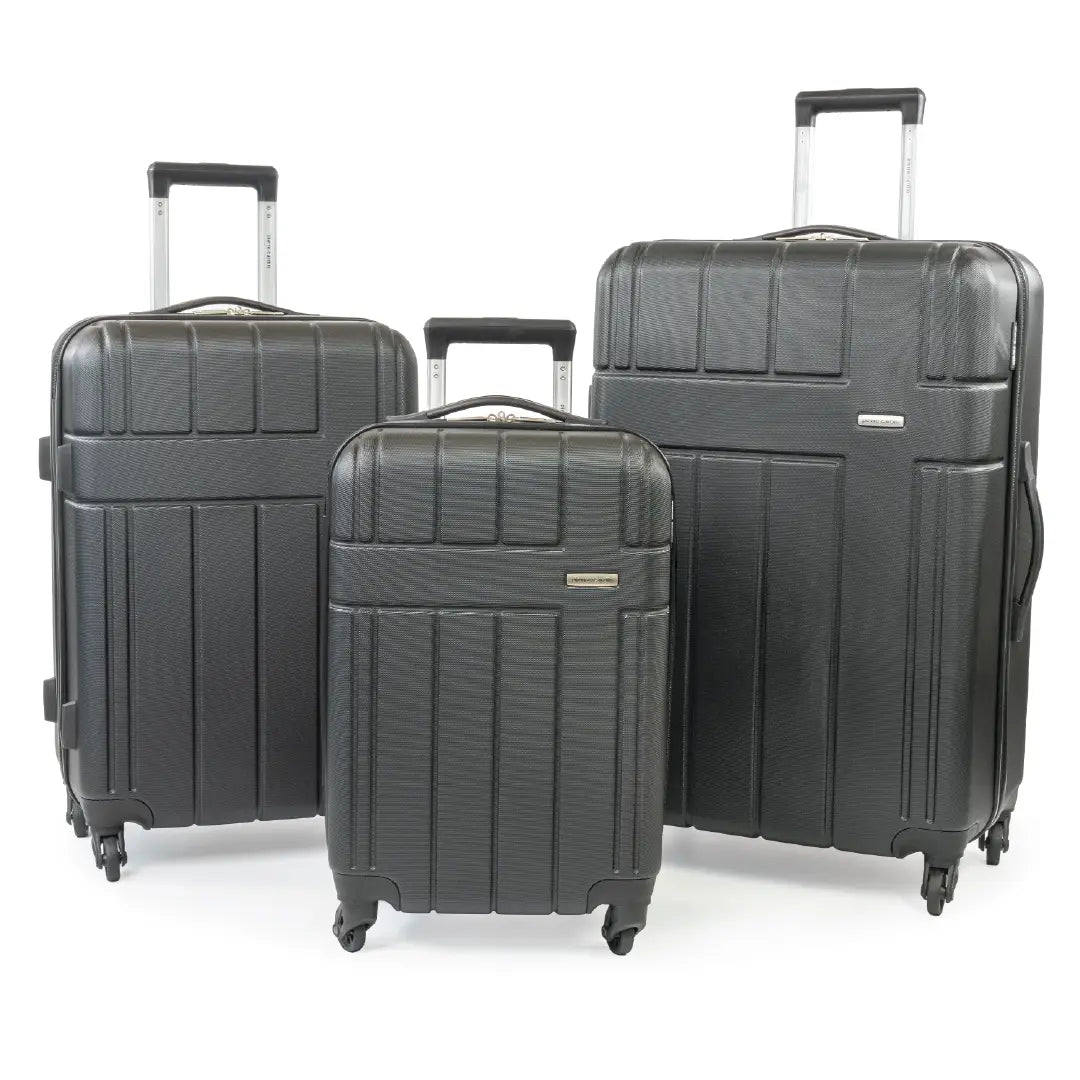 Three gray suitcases of different sizes on a white background