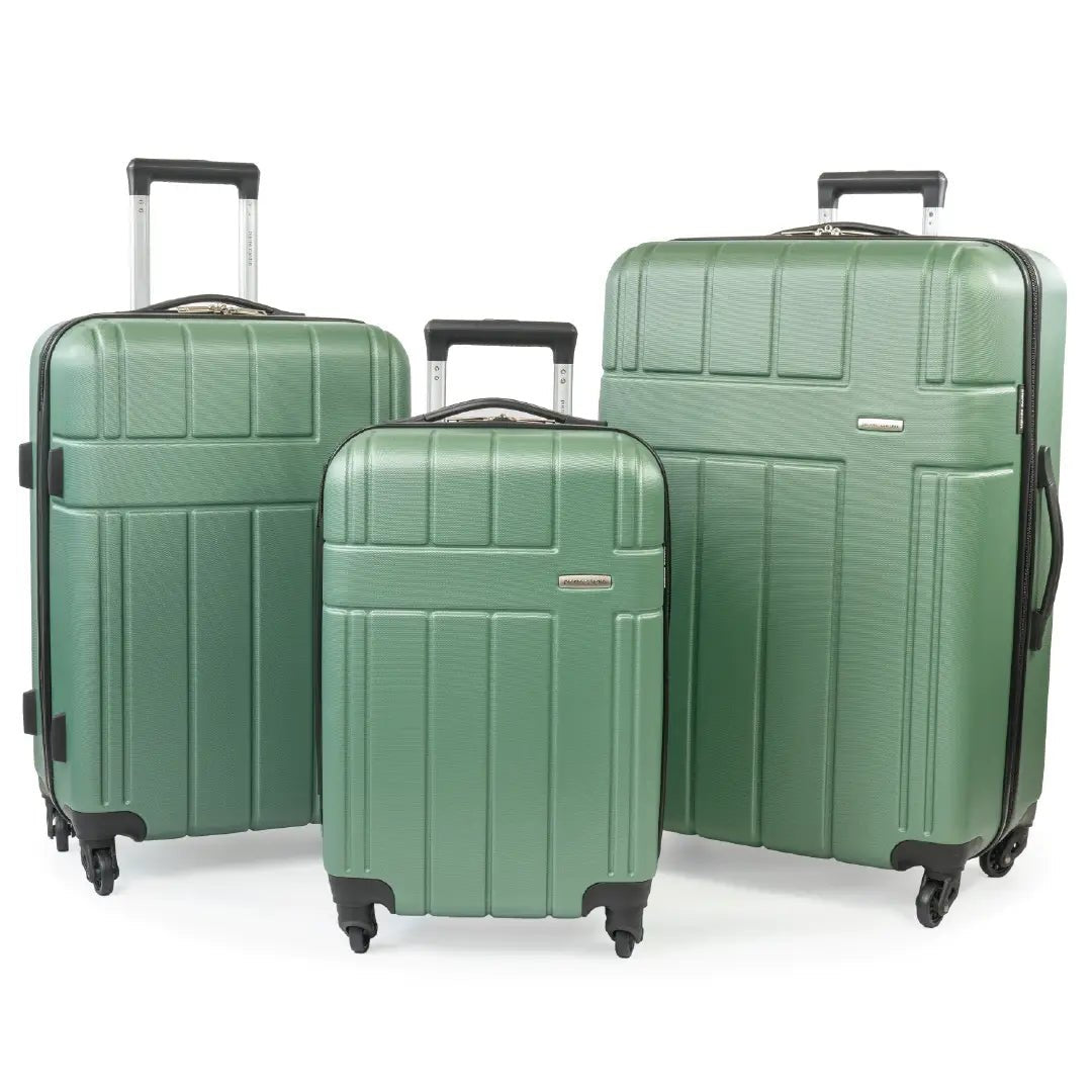 Three green suitcases of different sizes on a white background