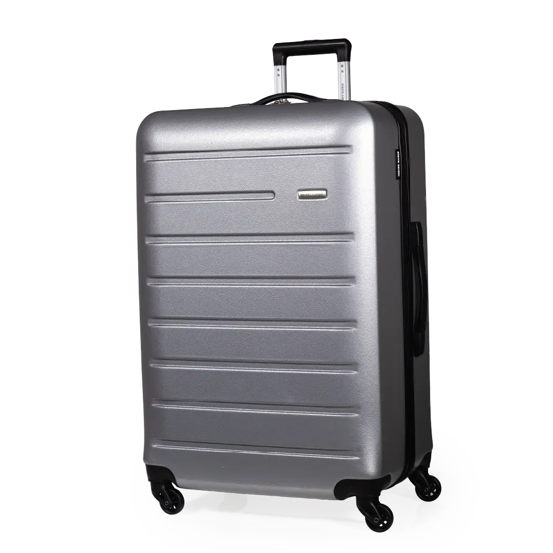 Silver suitcase with black handle and wheels on a white background