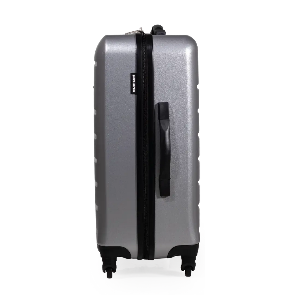 Silver suitcase with black handle and wheels on a white background