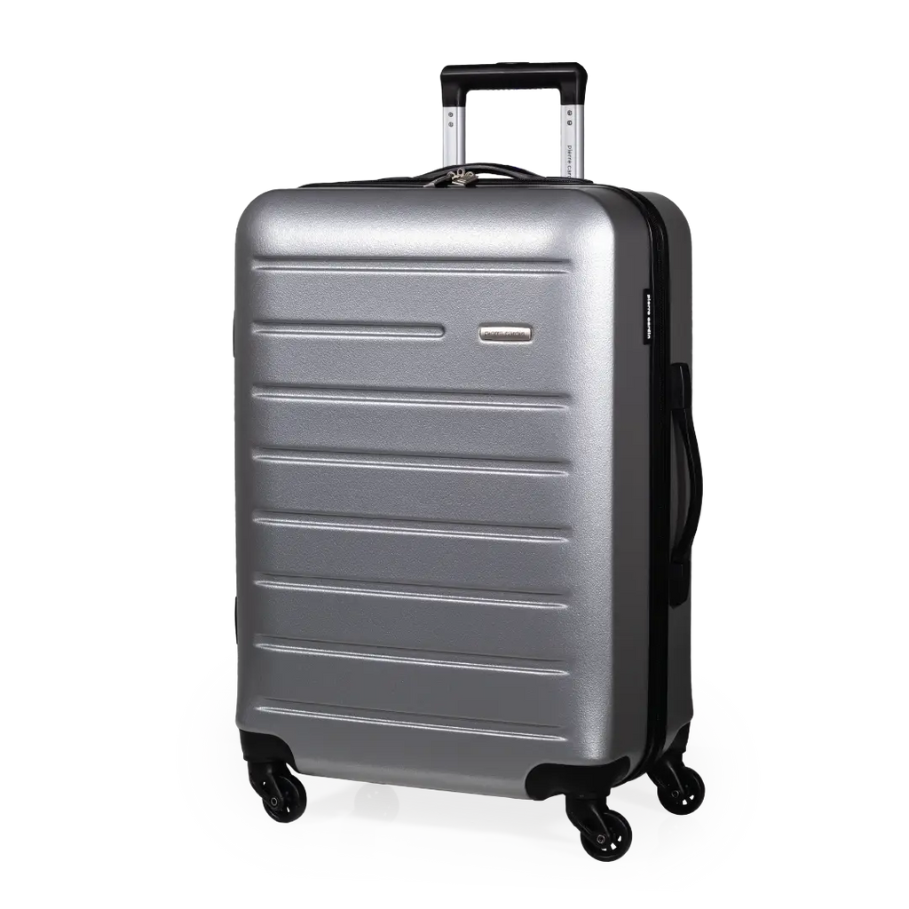 Silver suitcase with black wheels on a white background