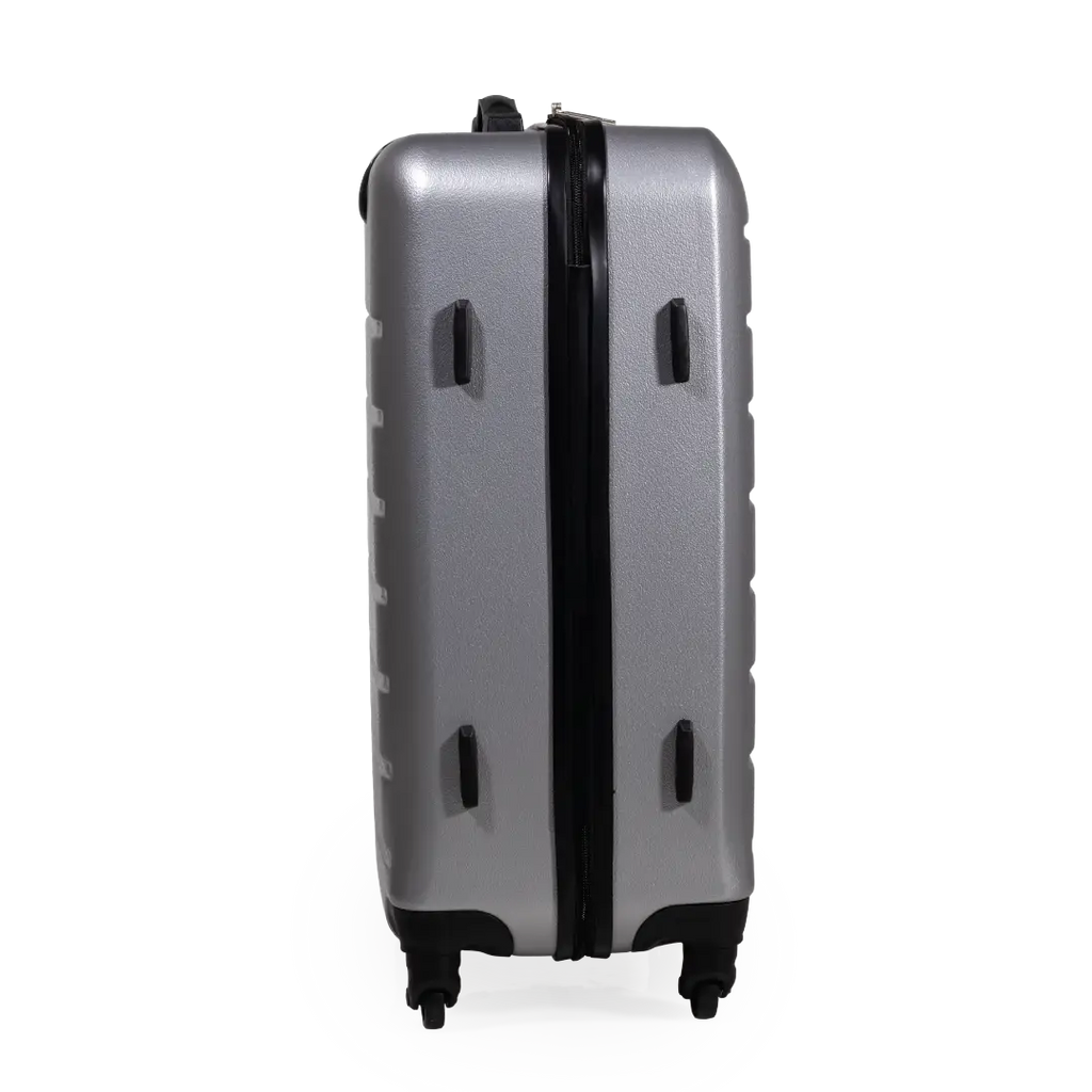 Silver suitcase with black handle and wheels on a white background