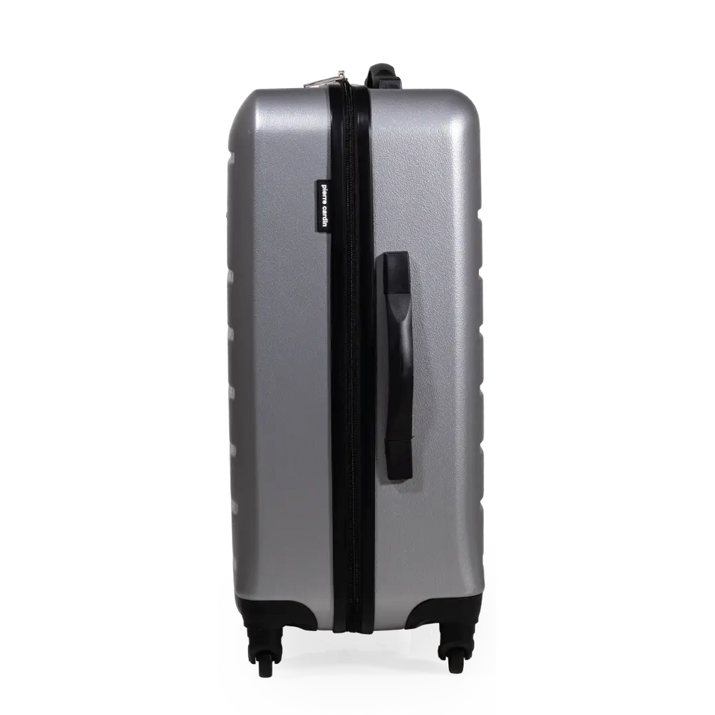 Silver suitcase with black handle and wheels on a white background