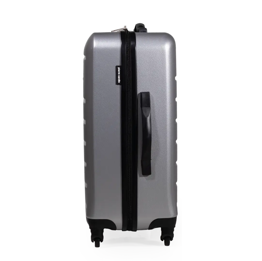Silver suitcase with black handle and wheels on a white background