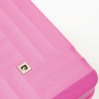 Close-up of a pink inflatable mattress with a brand logo on a white background