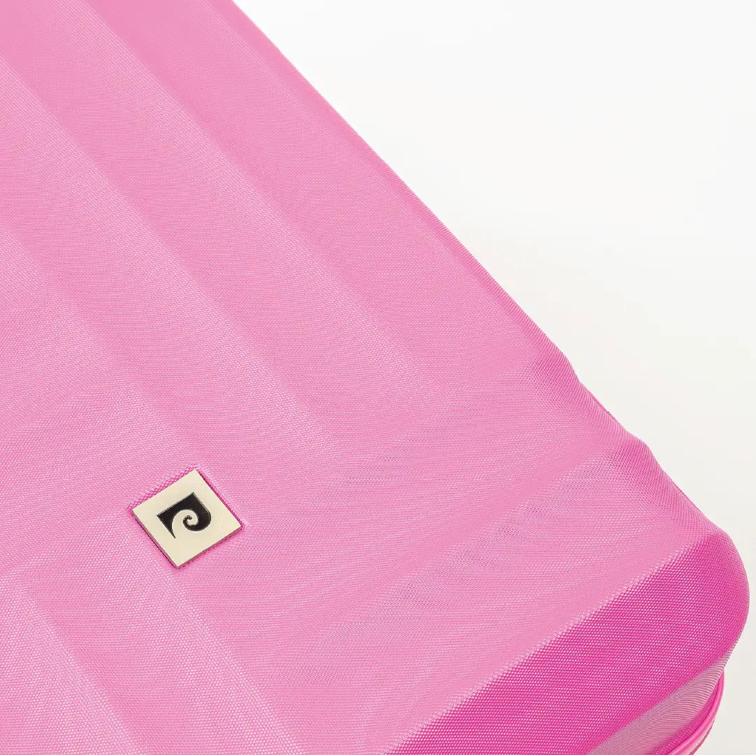 Close-up of a pink inflatable mattress with a brand logo on a white background